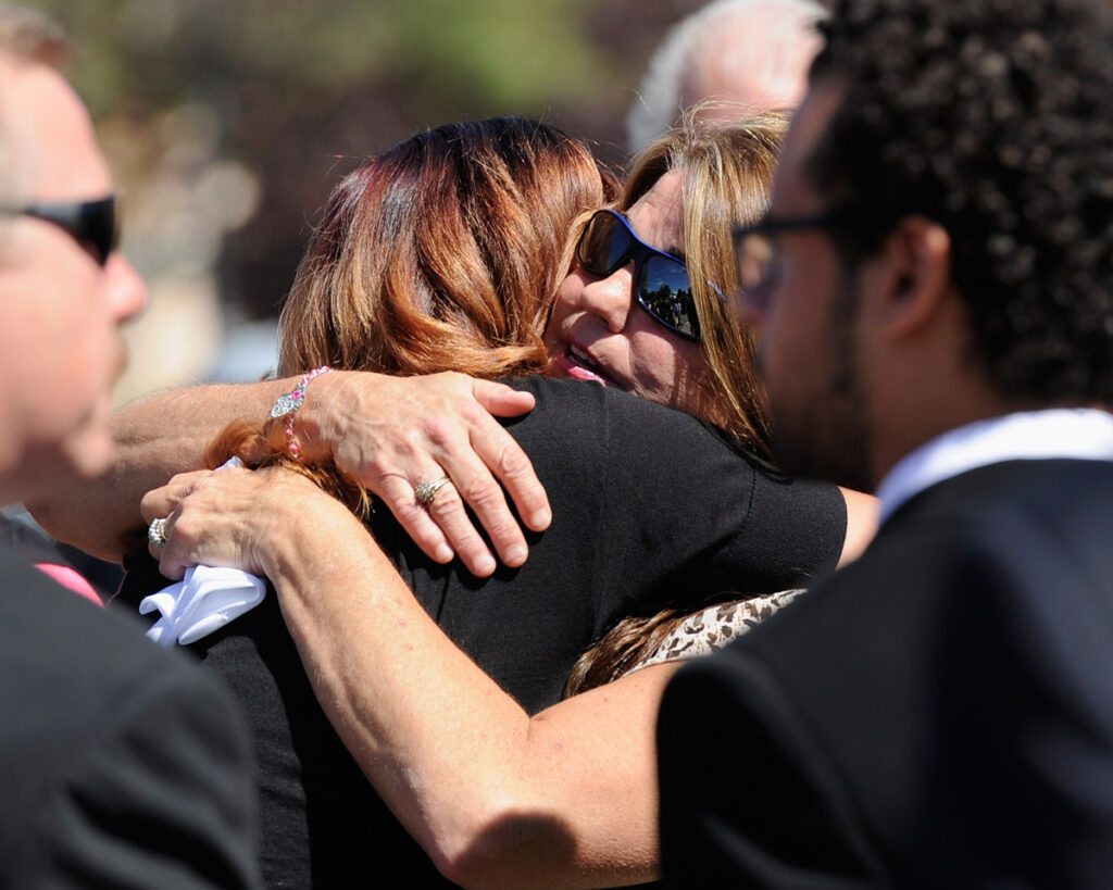Comforting embrace at funeral